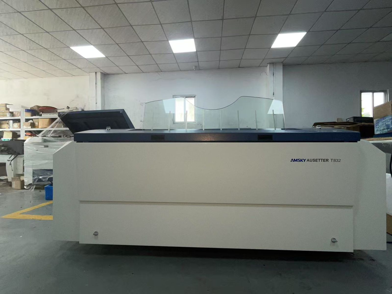 Engineer maintaining a CTP machine